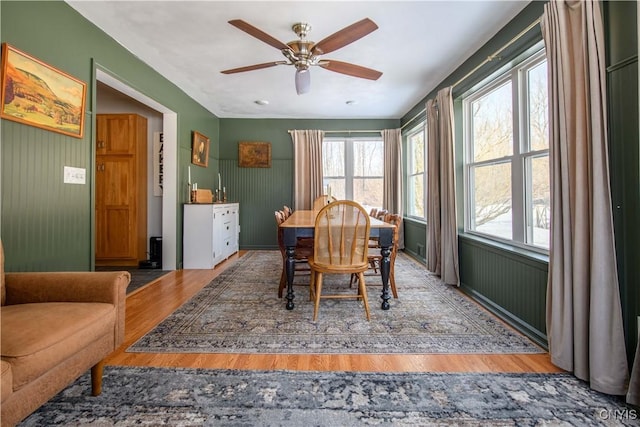 dining space featuring a ceiling fan and wood finished floors