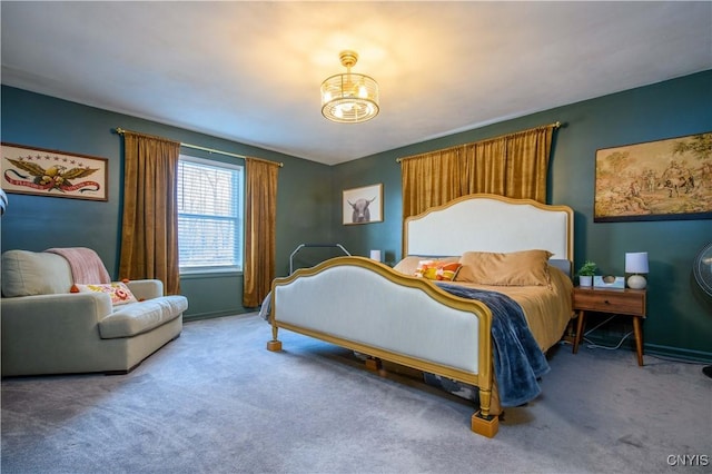 bedroom with carpet flooring and baseboards