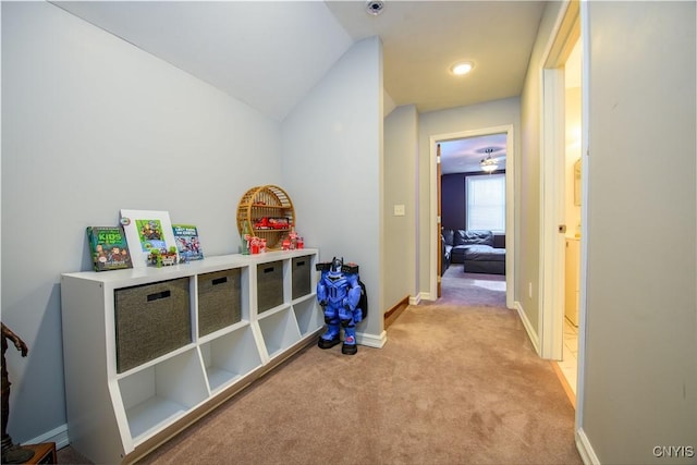 playroom featuring baseboards, lofted ceiling, and carpet