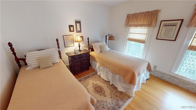 bedroom featuring light wood-style flooring