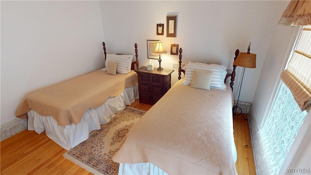 bedroom with light wood-style floors