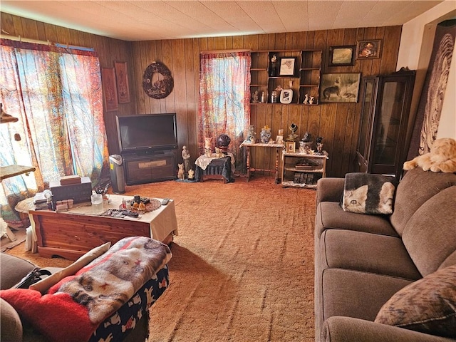 living room featuring carpet floors and wood walls