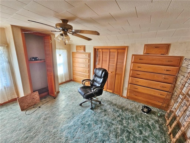 office featuring baseboards, carpet, and ceiling fan