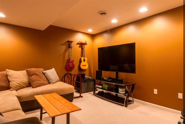 carpeted living area featuring visible vents, recessed lighting, and baseboards