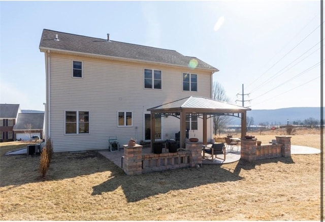 back of house featuring a gazebo and a patio area