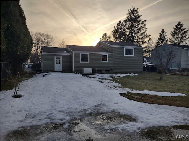 back of house at dusk with fence