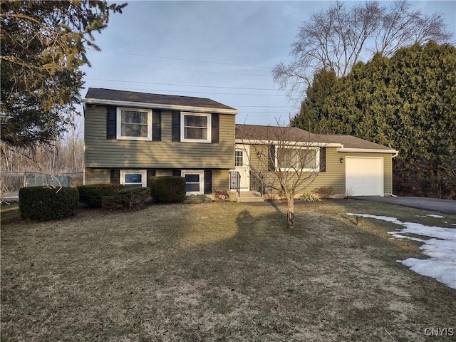 tri-level home with driveway and a garage