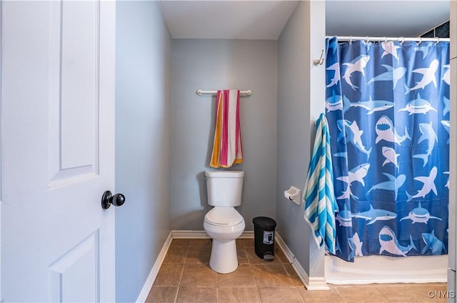 full bath with tile patterned floors, baseboards, and toilet