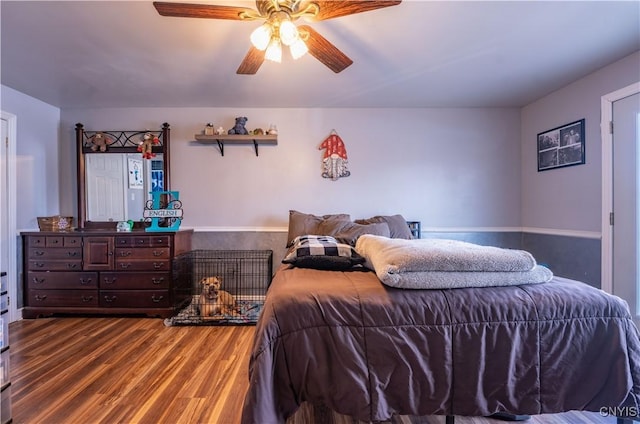 bedroom with a ceiling fan and wood finished floors