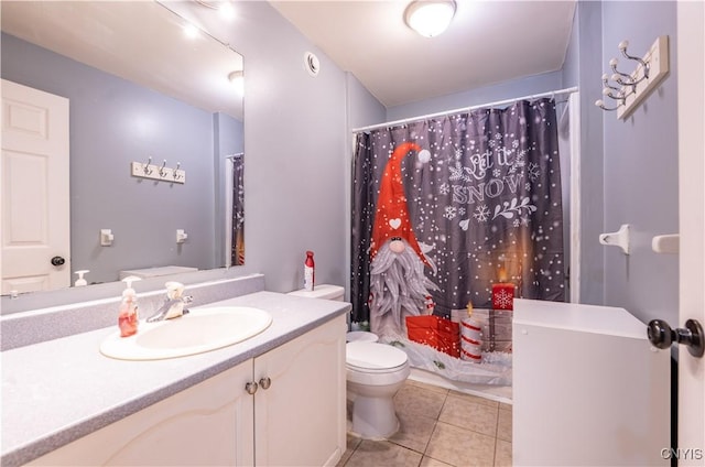 full bathroom featuring tile patterned floors, toilet, curtained shower, and vanity