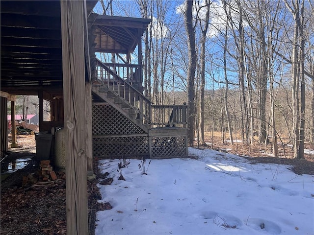 yard covered in snow with stairs