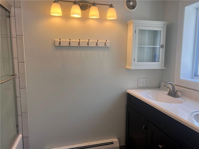 full bathroom with double vanity, visible vents, a baseboard radiator, and a sink