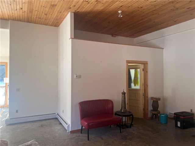 sitting room featuring plenty of natural light, wooden ceiling, concrete floors, and a baseboard radiator