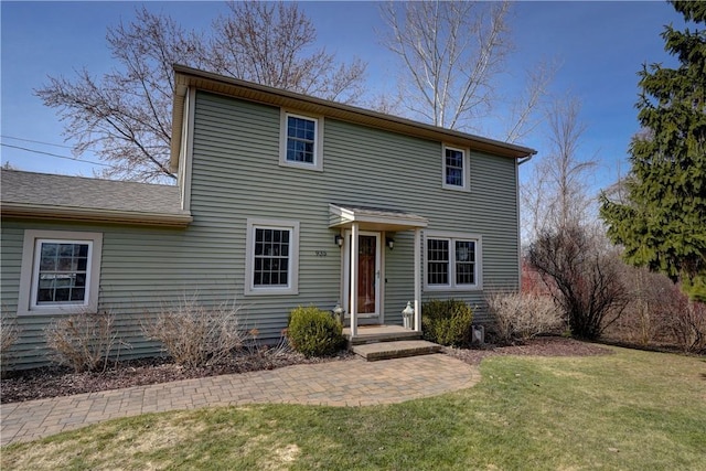 view of front of home with a front yard