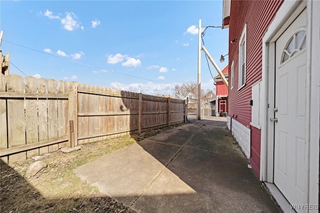 view of yard featuring a patio area and fence