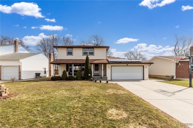 traditional-style home with solar panels, concrete driveway, a front yard, covered porch, and an attached garage