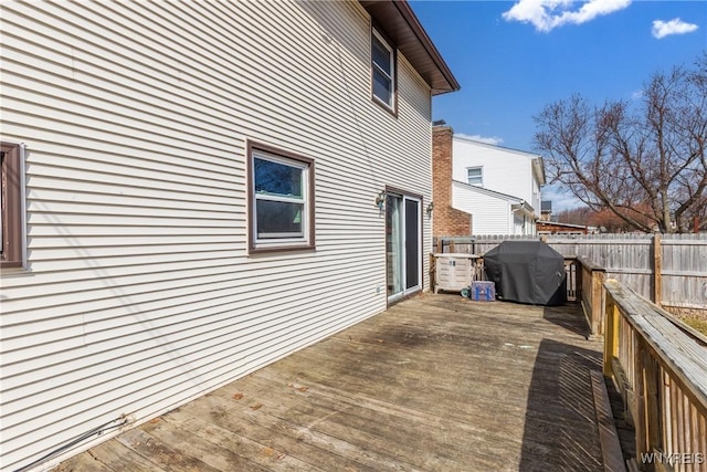 wooden terrace featuring fence and grilling area