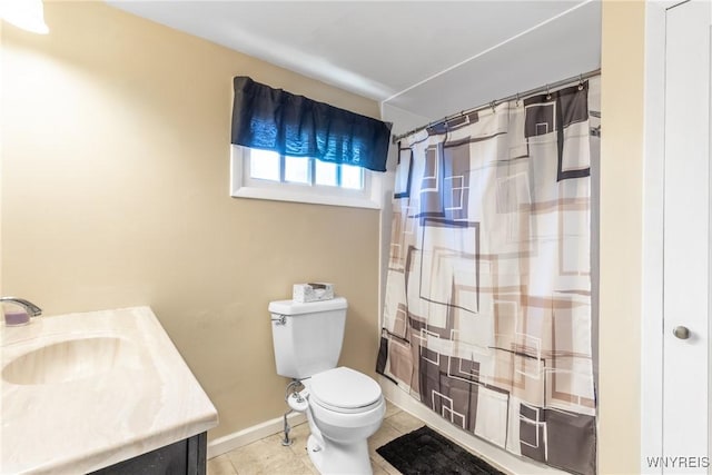 full bath featuring tile patterned flooring, toilet, vanity, and baseboards