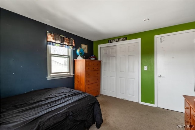 bedroom featuring a closet and carpet