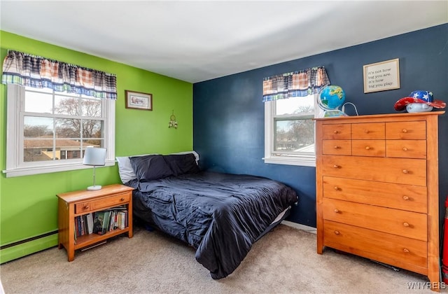 bedroom with carpet, baseboards, and baseboard heating