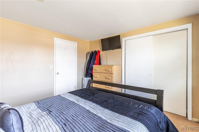 bedroom with a closet and carpet flooring