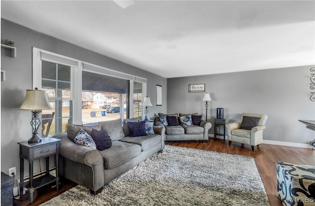 living room with wood finished floors and baseboards