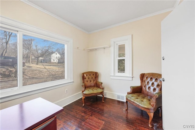 living area featuring a wealth of natural light, visible vents, dark wood-type flooring, and crown molding