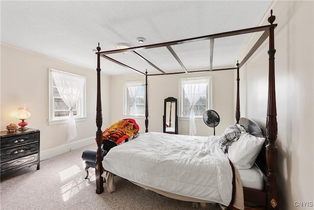 bedroom featuring carpet and baseboards