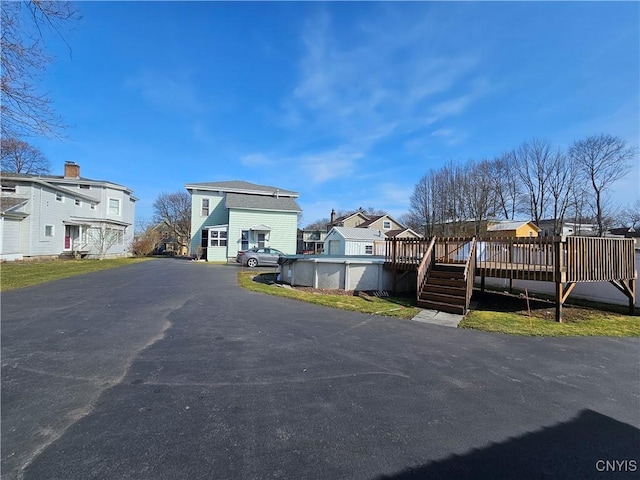 view of road with a residential view and stairs