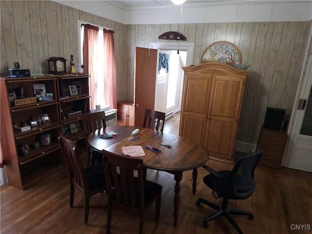 dining space with wood finished floors