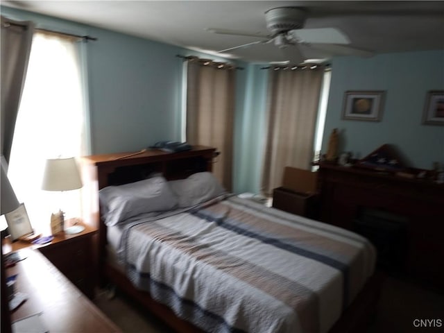 bedroom featuring ceiling fan