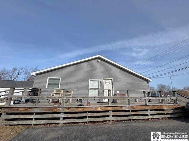 back of property with a deck