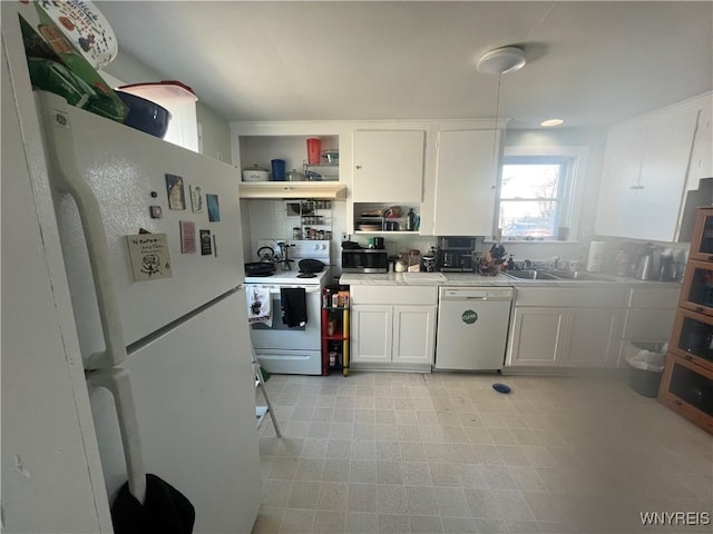 kitchen featuring white appliances, open shelves, a sink, light countertops, and white cabinetry