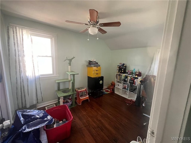 rec room with ceiling fan, lofted ceiling, and wood finished floors