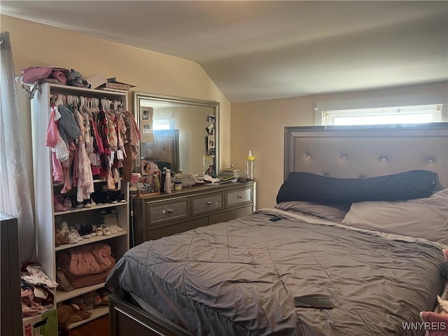 bedroom with lofted ceiling