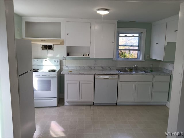 kitchen featuring white appliances, open shelves, a sink, white cabinets, and backsplash