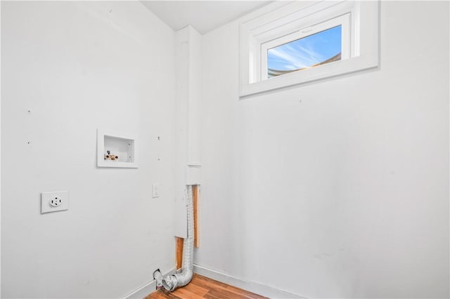 laundry room featuring electric dryer hookup, light wood-type flooring, washer hookup, baseboards, and laundry area