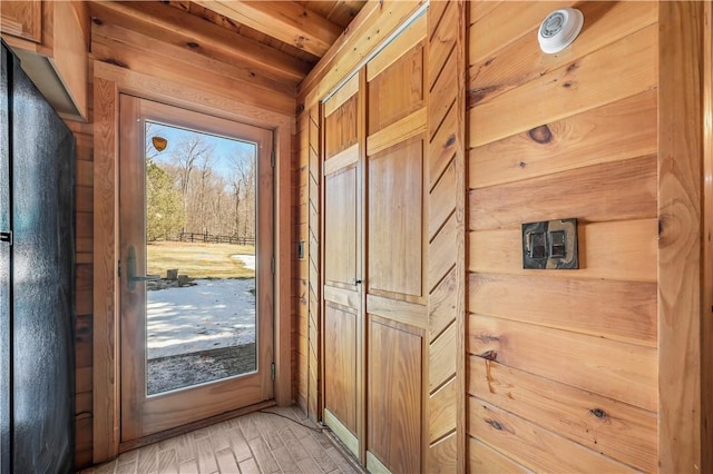 doorway to outside with light wood-style floors