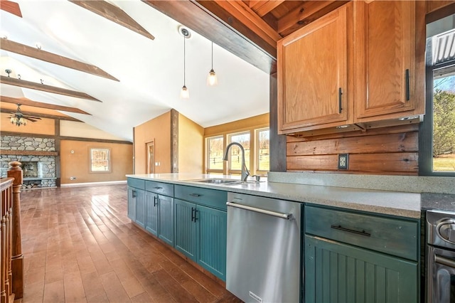 kitchen with vaulted ceiling with beams, ceiling fan, a sink, stainless steel dishwasher, and open floor plan