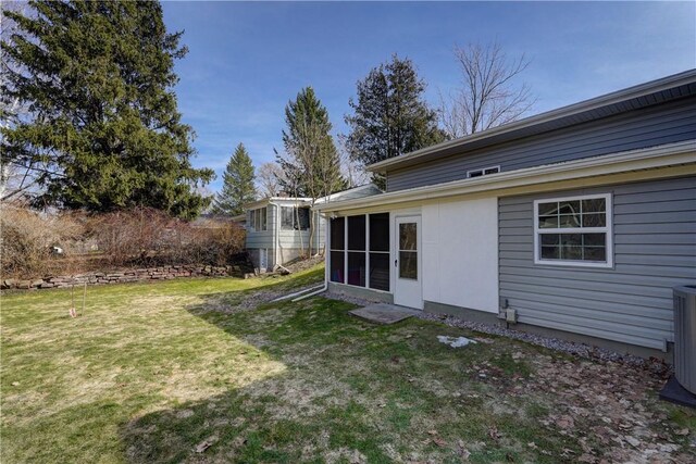 view of yard featuring a sunroom