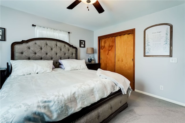 bedroom featuring a closet, baseboards, carpet floors, and ceiling fan