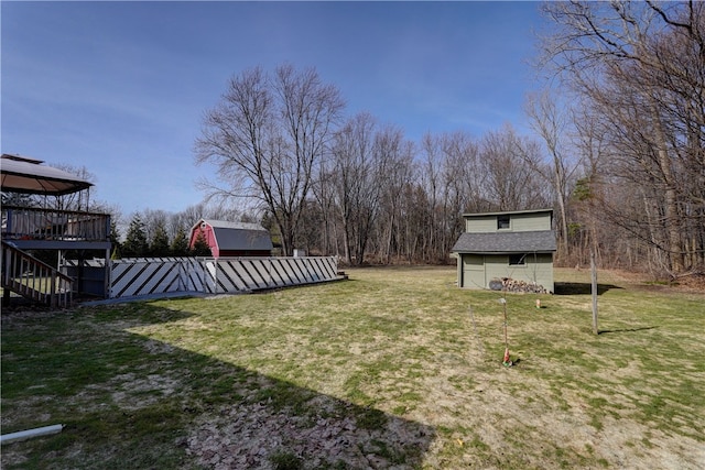 view of yard with an outdoor structure and stairway