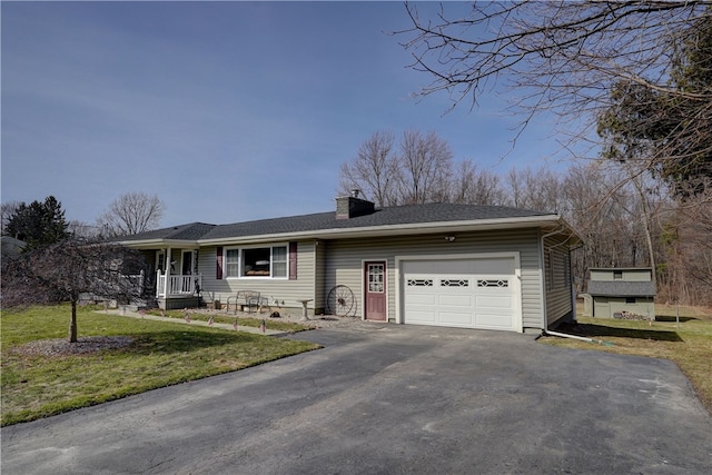 single story home with aphalt driveway, a front lawn, a chimney, and an attached garage