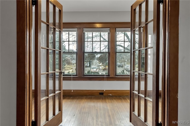 doorway to outside with hardwood / wood-style floors and french doors