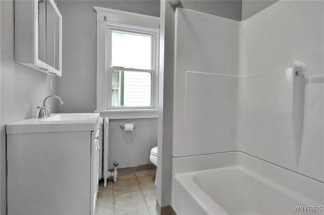 bathroom with tile patterned floors, shower / bath combination, toilet, and vanity