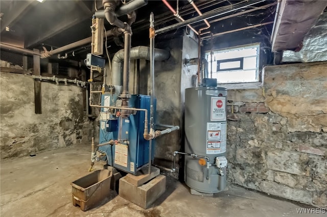 utility room featuring water heater