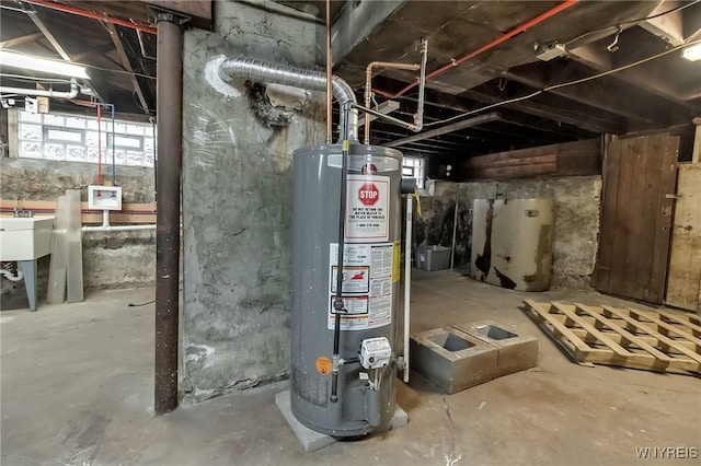 utility room with gas water heater