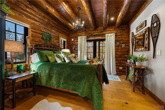 1392 Big Moose Rd, Webb, NY 13331 - bedroom featuring rustic walls, wooden ceiling with exposed beams, multiple windows, light wood finished floors, and a chandelier