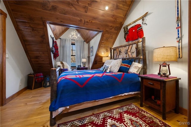 1392 Big Moose Rd, Webb, NY 13331 - bedroom featuring vaulted ceiling, hardwood / wood-style floors, wooden ceiling, and baseboards