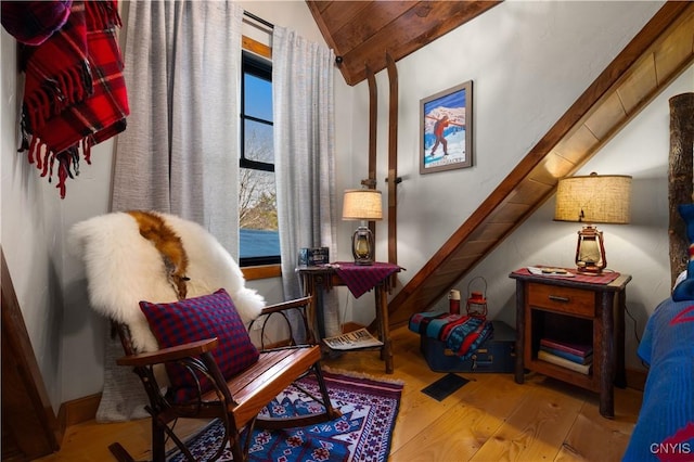 1392 Big Moose Rd, Webb, NY 13331 - sitting room with lofted ceiling and wood finished floors